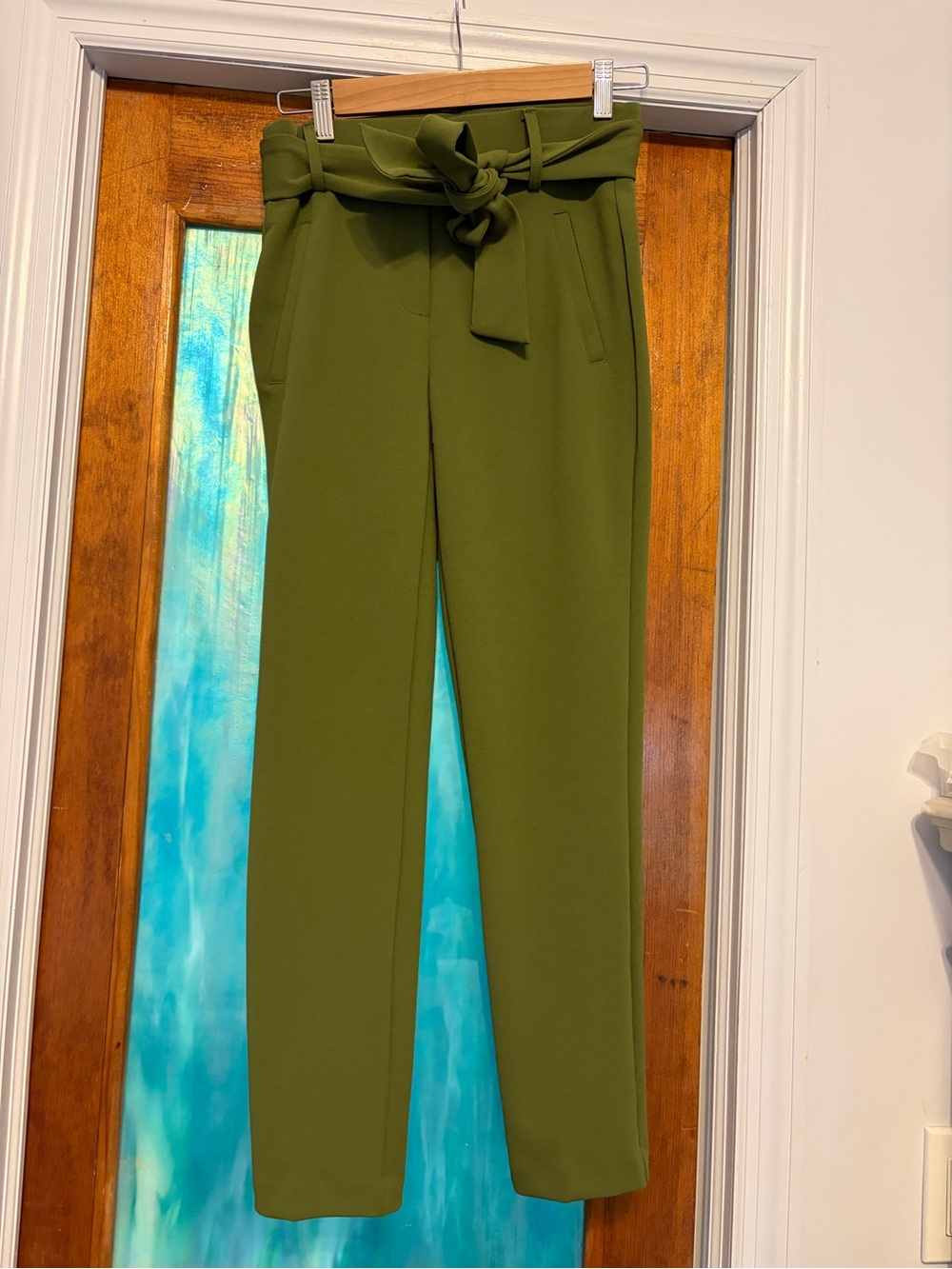Jules & Leopold green skinny dress pants with bow tie belt
